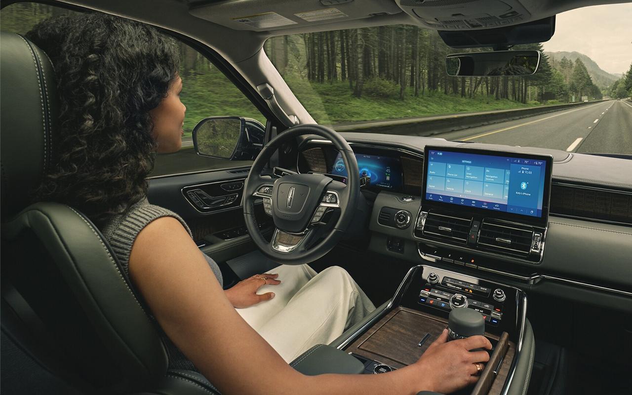 Woman enjoying the drive inside The new 2023 Lincoln Navigator® SUV from South Bay Lincoln