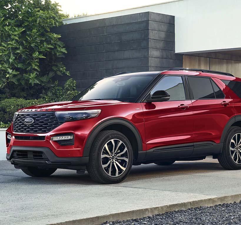 Red 2022 Ford Explorer parked in a home driveway