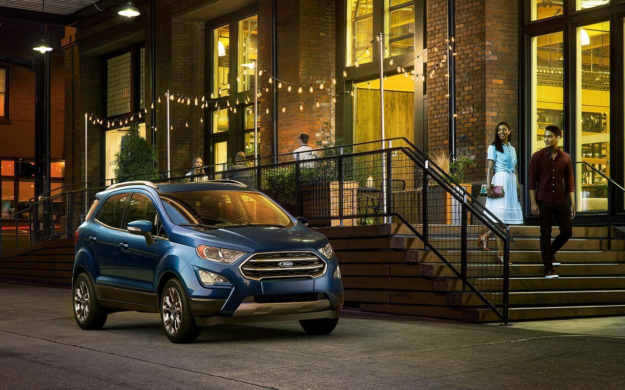 2022 Ford EcoSport parked in front of a restaurant with a couple walking out