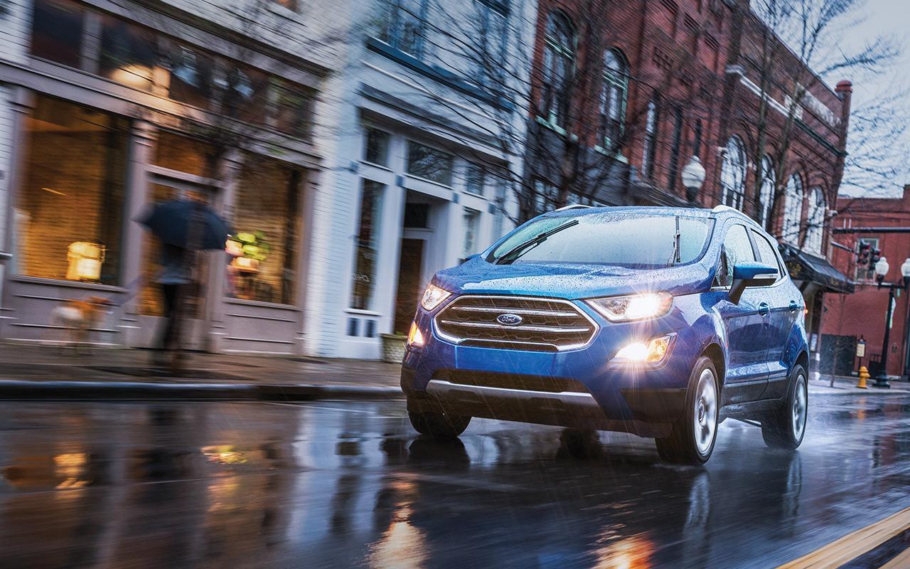 2022 Ford EcoSport driving through a city on a rainy day