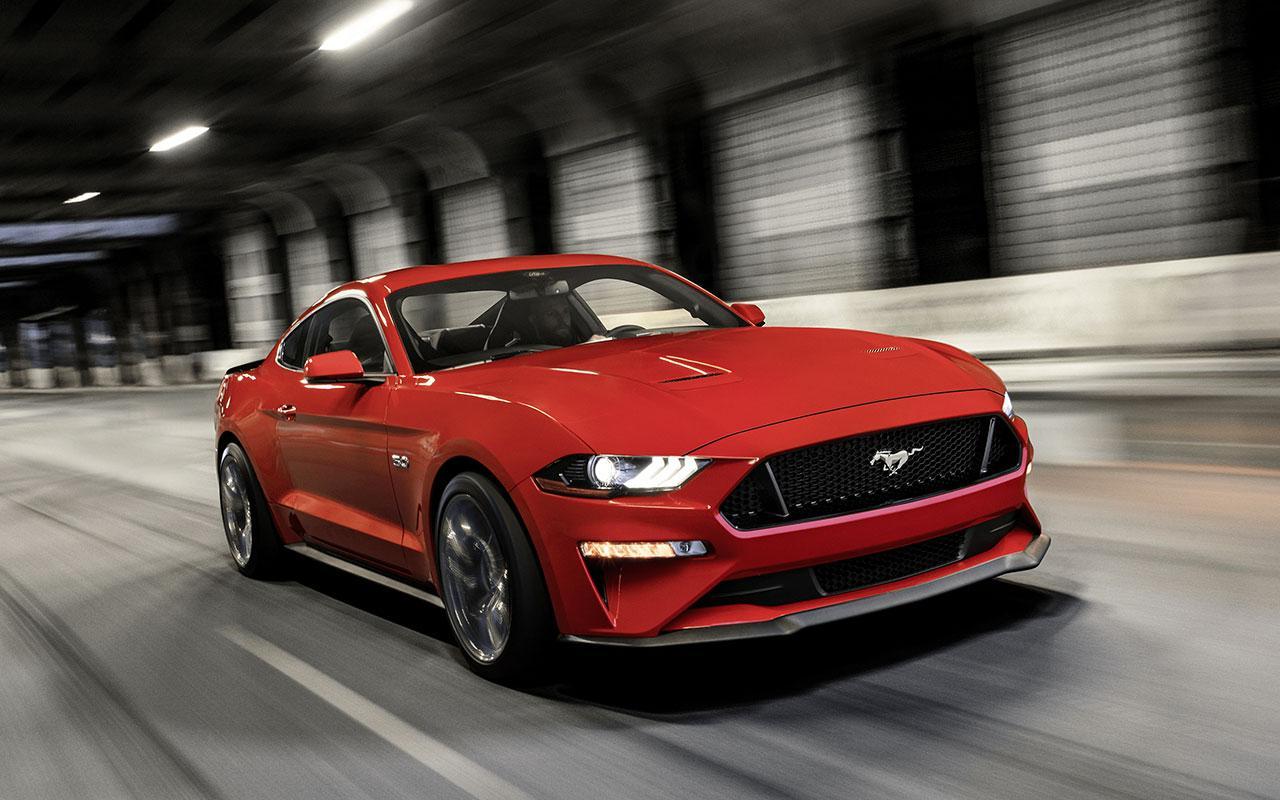 2022 Ford Mustang speeding through a tunnel