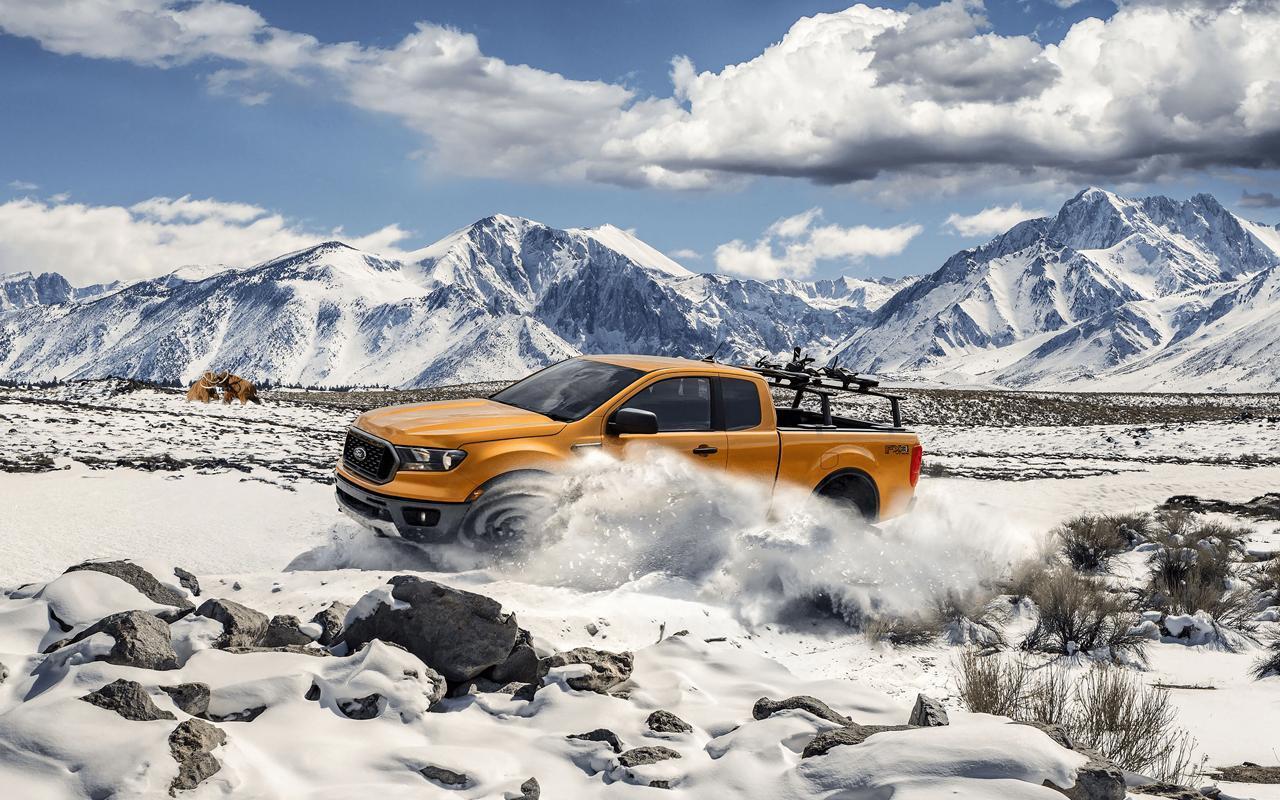 2022 Ford Ranger driving through a snowy mountain