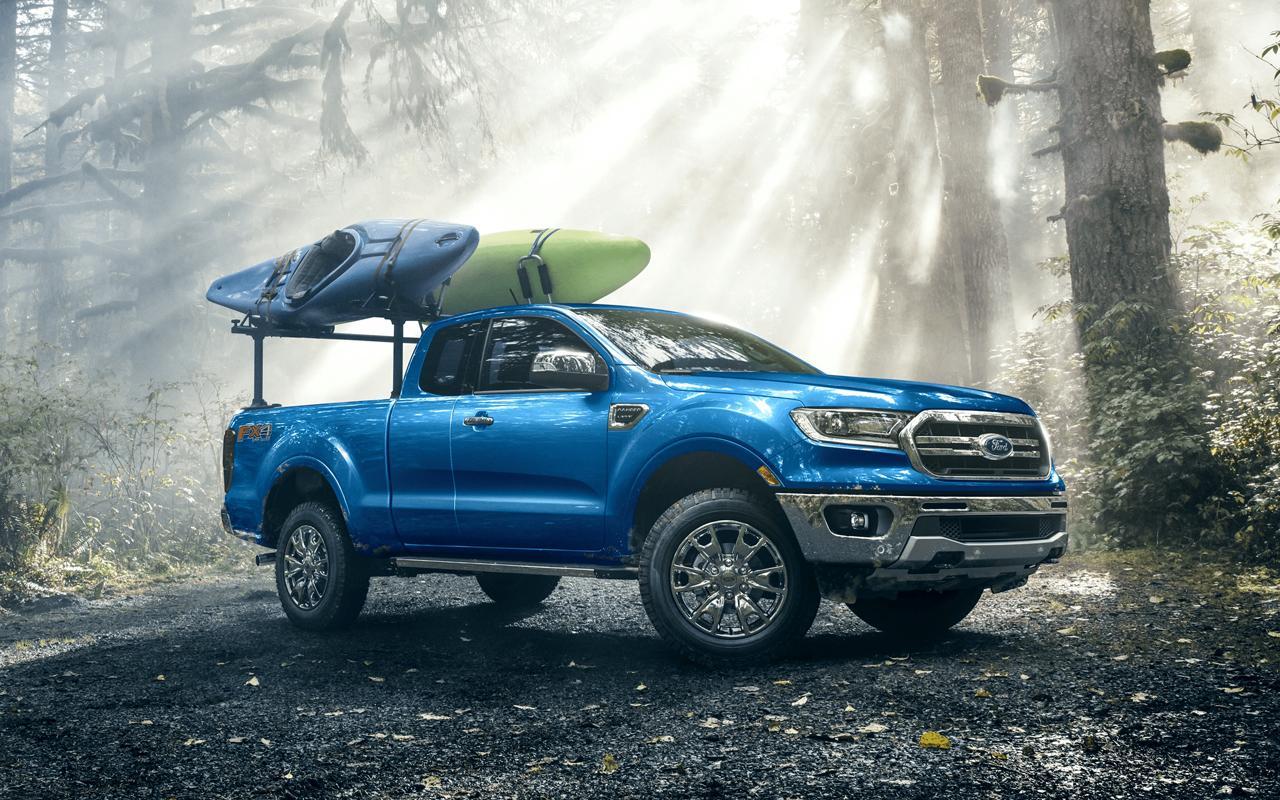 2022 Ford Ranger with two kayaks on top in the middle of a forest
