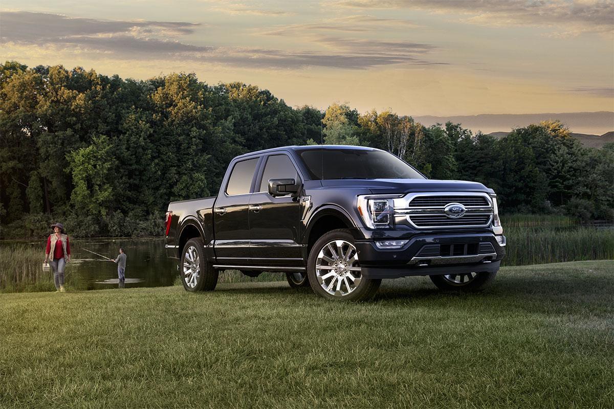 2023 FORD F-150® Parked next to a pond as a man fishes | South Bay Ford