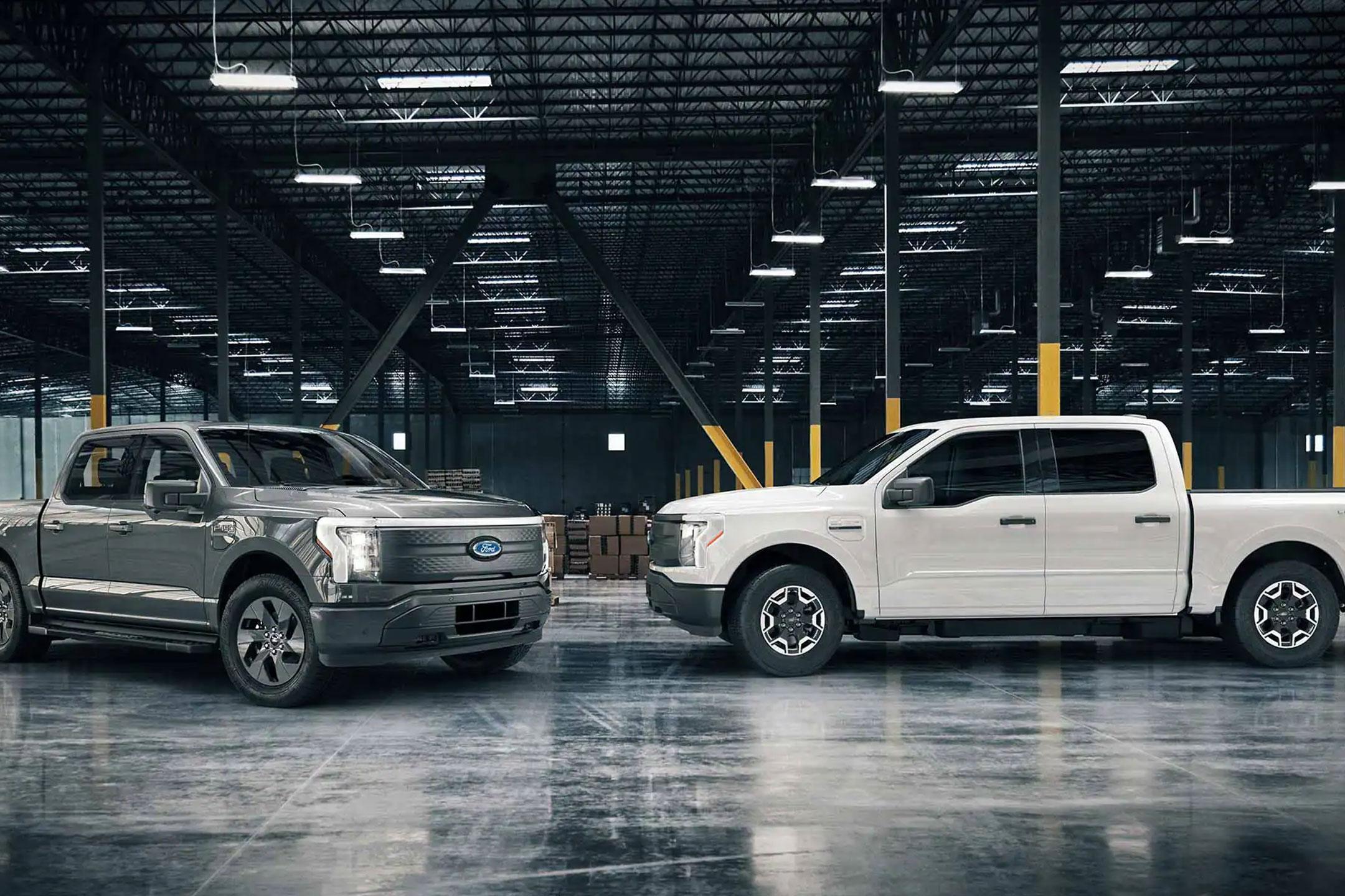 Two 2022 Ford F-150 Lightning trucks in a warehouse