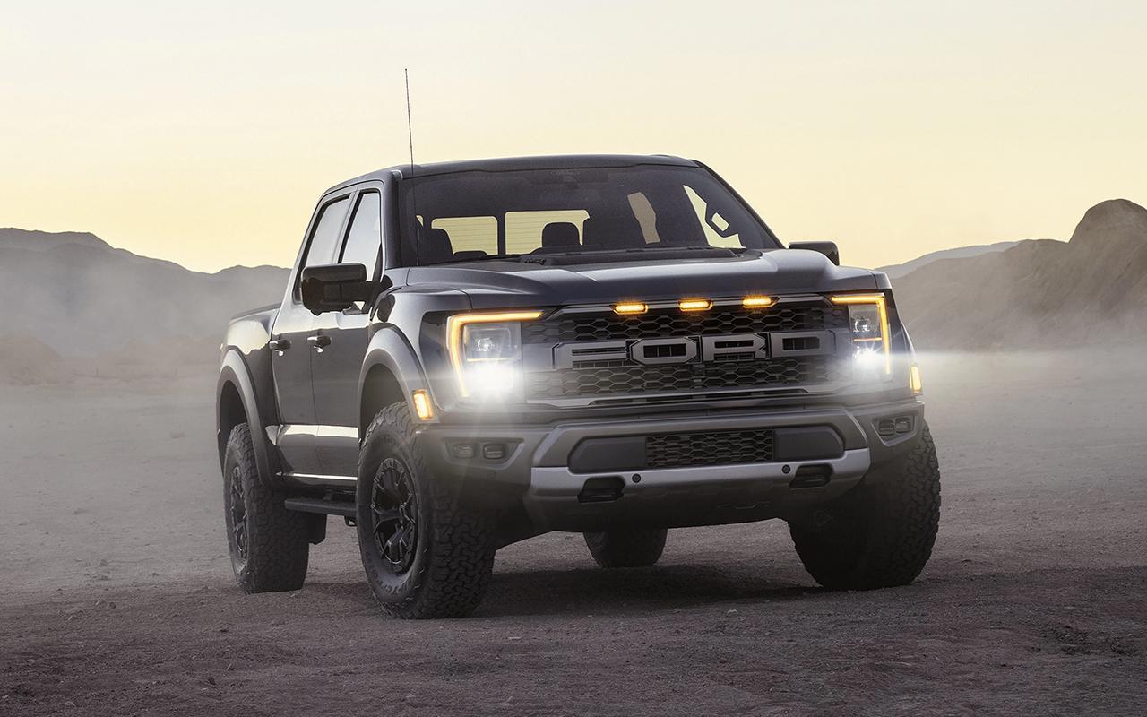 2022 Ford F-150 with the lights on in a dessert area at night