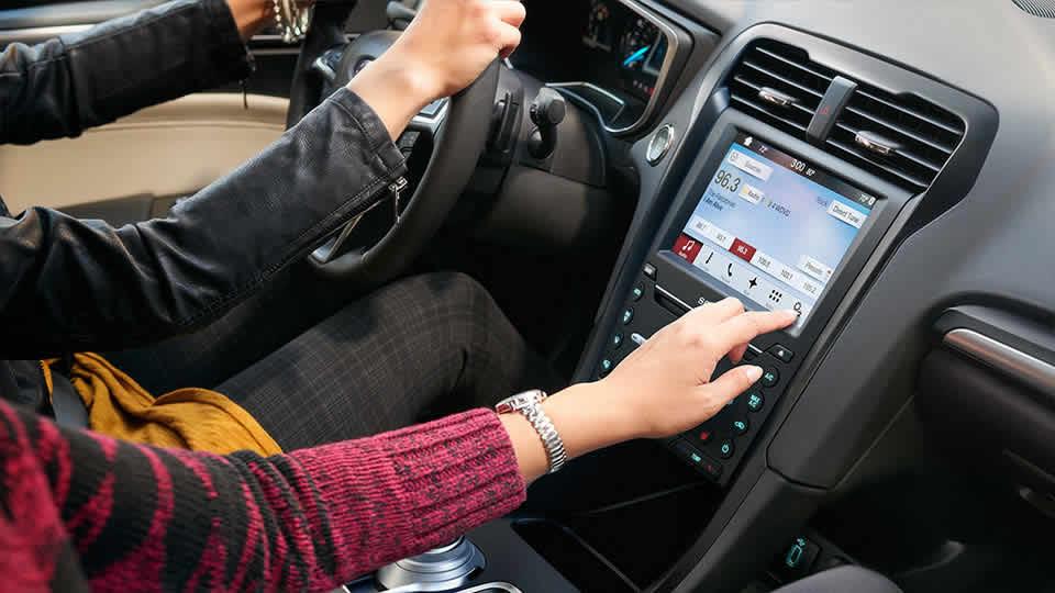 The 2017 Ford Fusion Titanium shown in Medium Soft Ceramic with available SYNC® 390 voice-activated technology 2017 Ford Fusion Titanium Medium Soft Ceramic with available SYNC® 390 voice-activated technology