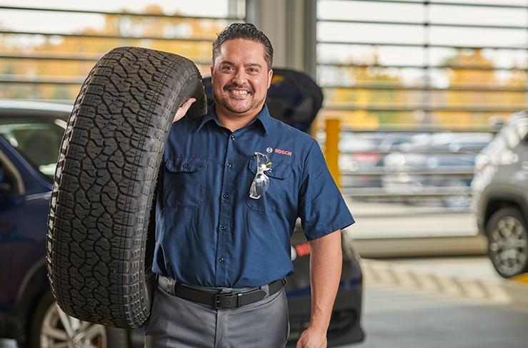 Bosch Auto Service repair technician after performing vehicle maintenance