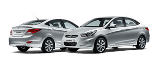 Two silver Hyundai Accents Two silver Hyundai Accents