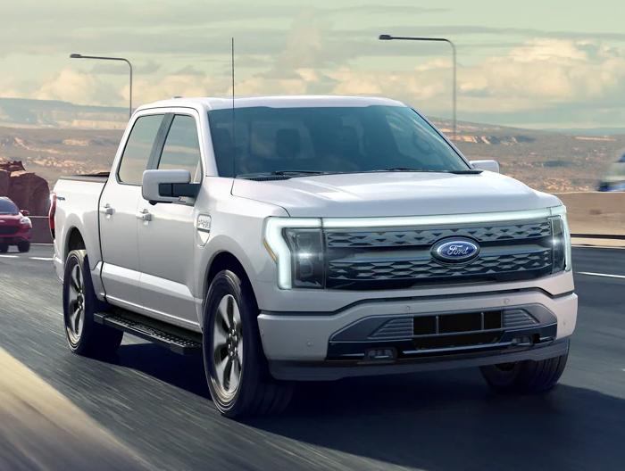 A 2023 Ford F-150 Lightning® being driven on a highway
