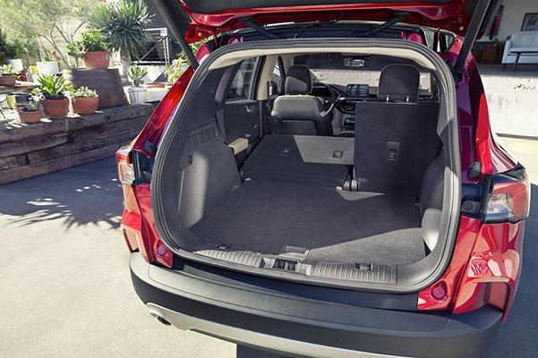 rear view of Ford Escape crossover with the back door open showcasing space capability
